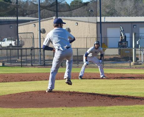 Pitcher Chris Wease delivers as Josh Melendez leads off first in Thursday's scrimmage.
