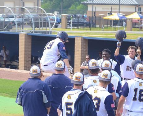 Tyler Quave (#19) jumps on home plate and into his teammates after hitting a grand slam vs. Pearl River Apr. 26.