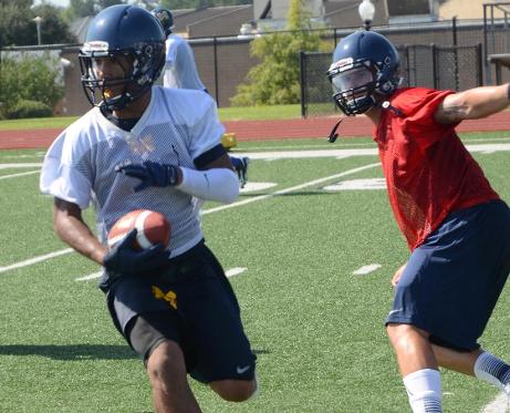 MGCCC QB Colton Kane hands off to Ishmel Morrow at the team's first fall practice Aug. 7.