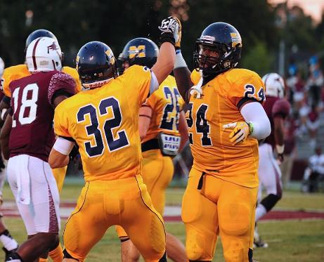 MACJC Defensive player of the Week Cavellis Luckett (#24) congratulates Elijah Parker after an interception vs. Hinds last week.