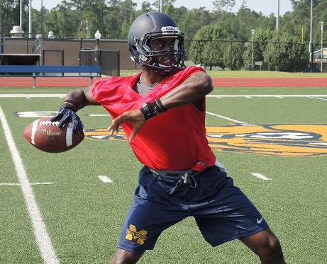MGCCC quarterback Jason Smith sets up for a pass at practice Aug. 7.