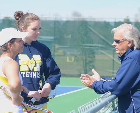Tennis coach Gary Bourgeois (right) talks with Kit Chowdhary & Christa Owen before a recent match.