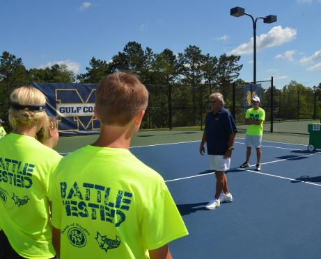 MGCCC tennis coach Gary Bourgeois speaks with campers June 11.