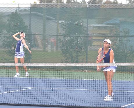 Brittany Buker (far left) & Kit Chowdhary competing in a match last fall.